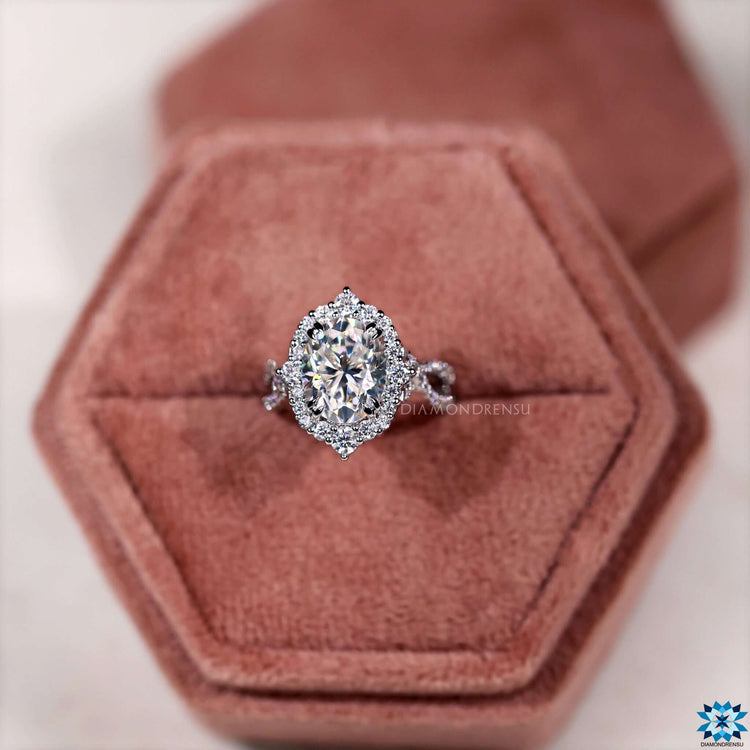 White gold moissanite ring with double claw prong setting.