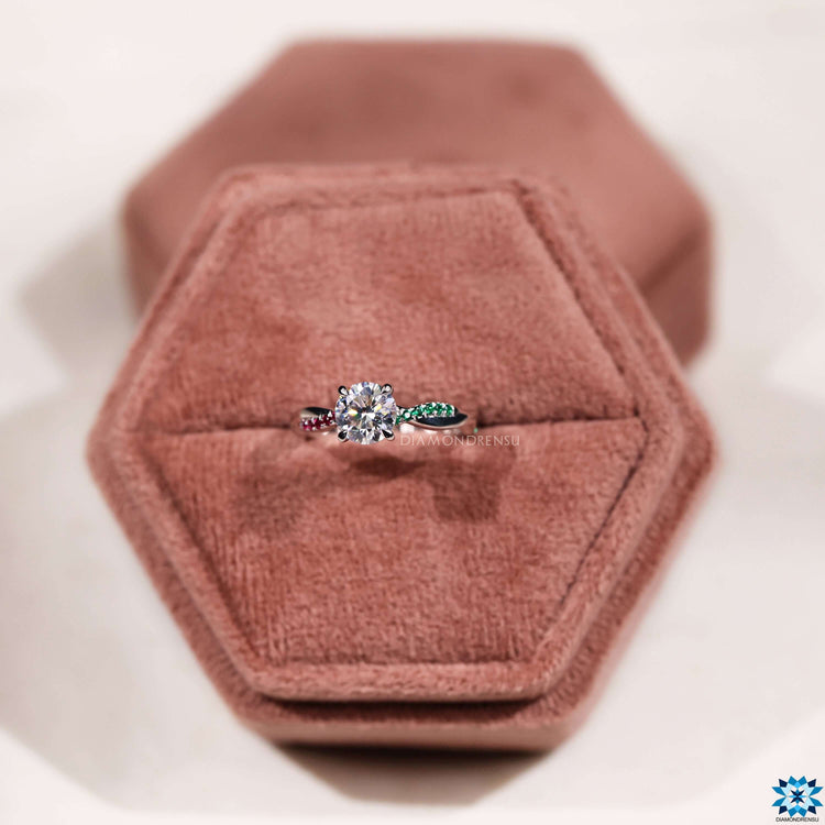 4 prong moissanite ring with twisted band and gemstone accents.