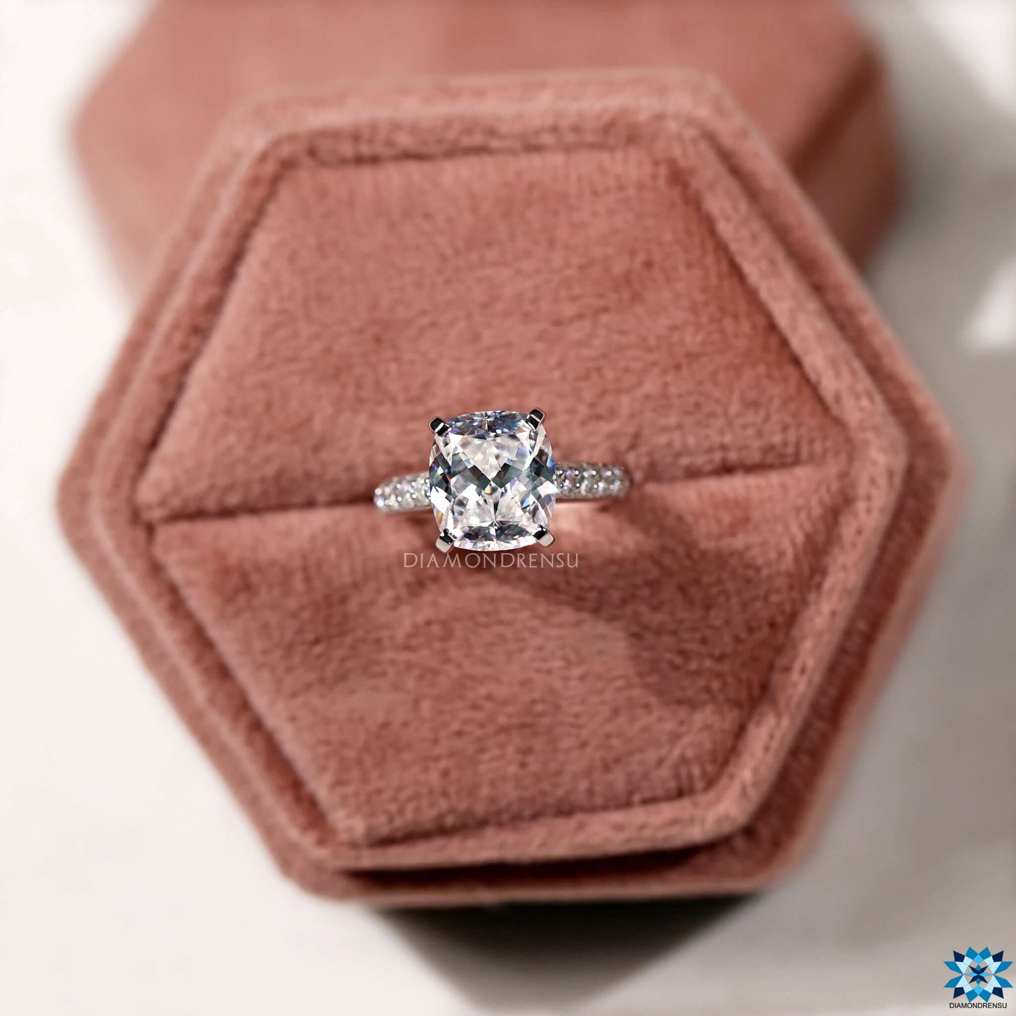 White gold ring with a beautiful cushion cut engagement ring setting.
