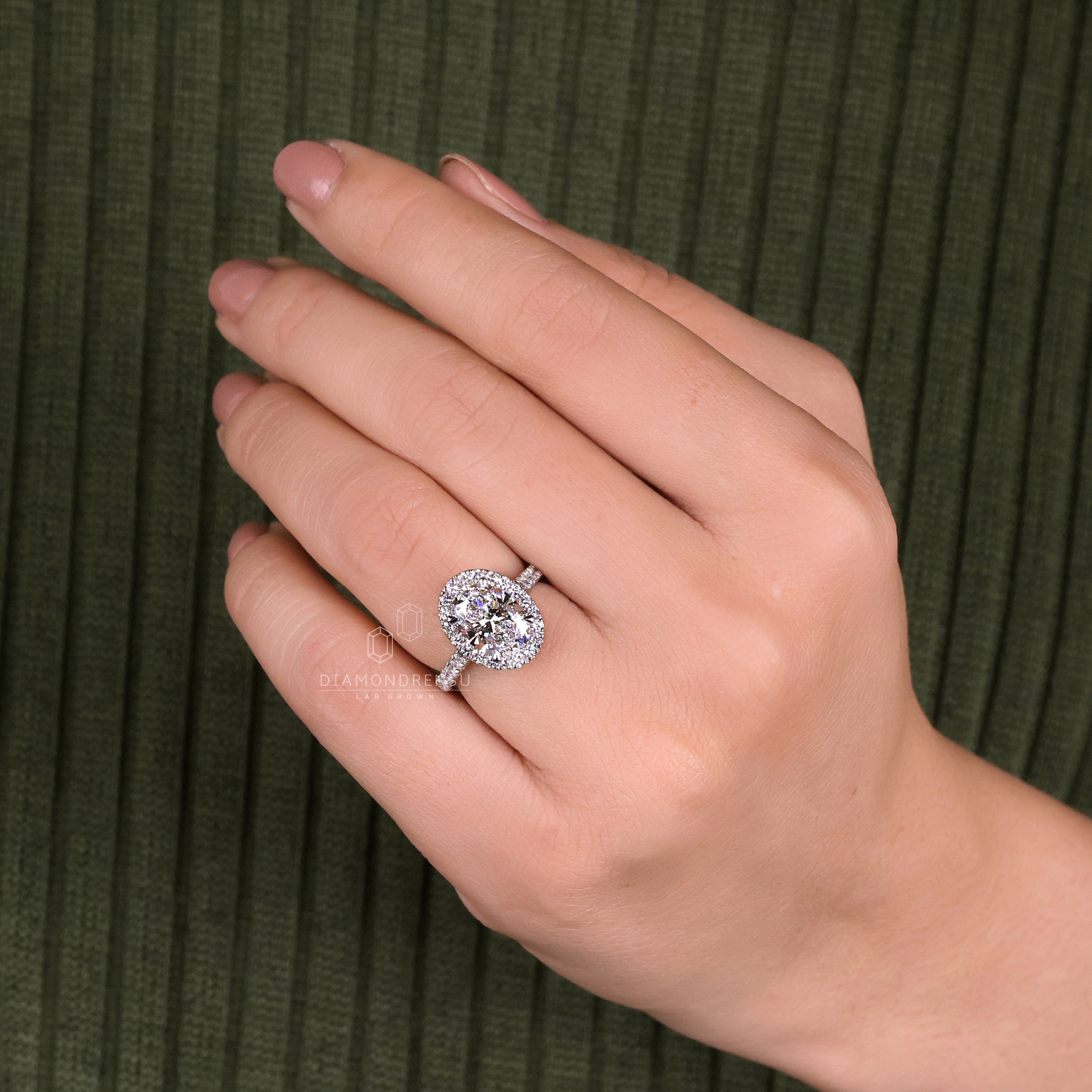 Oval halo ring featuring a cathedral setting for added elegance.