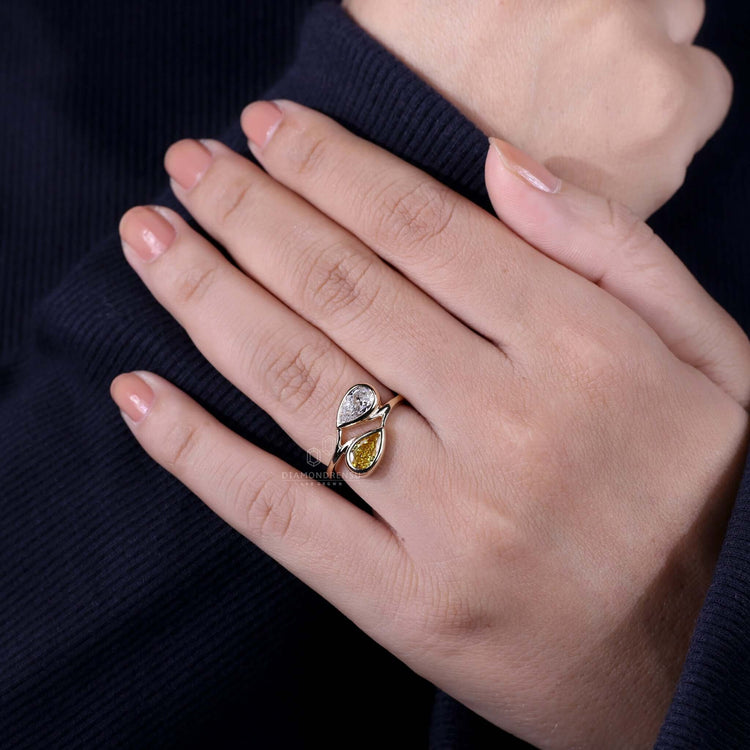 Bezel pear engagement ring with modern elegance and charm.