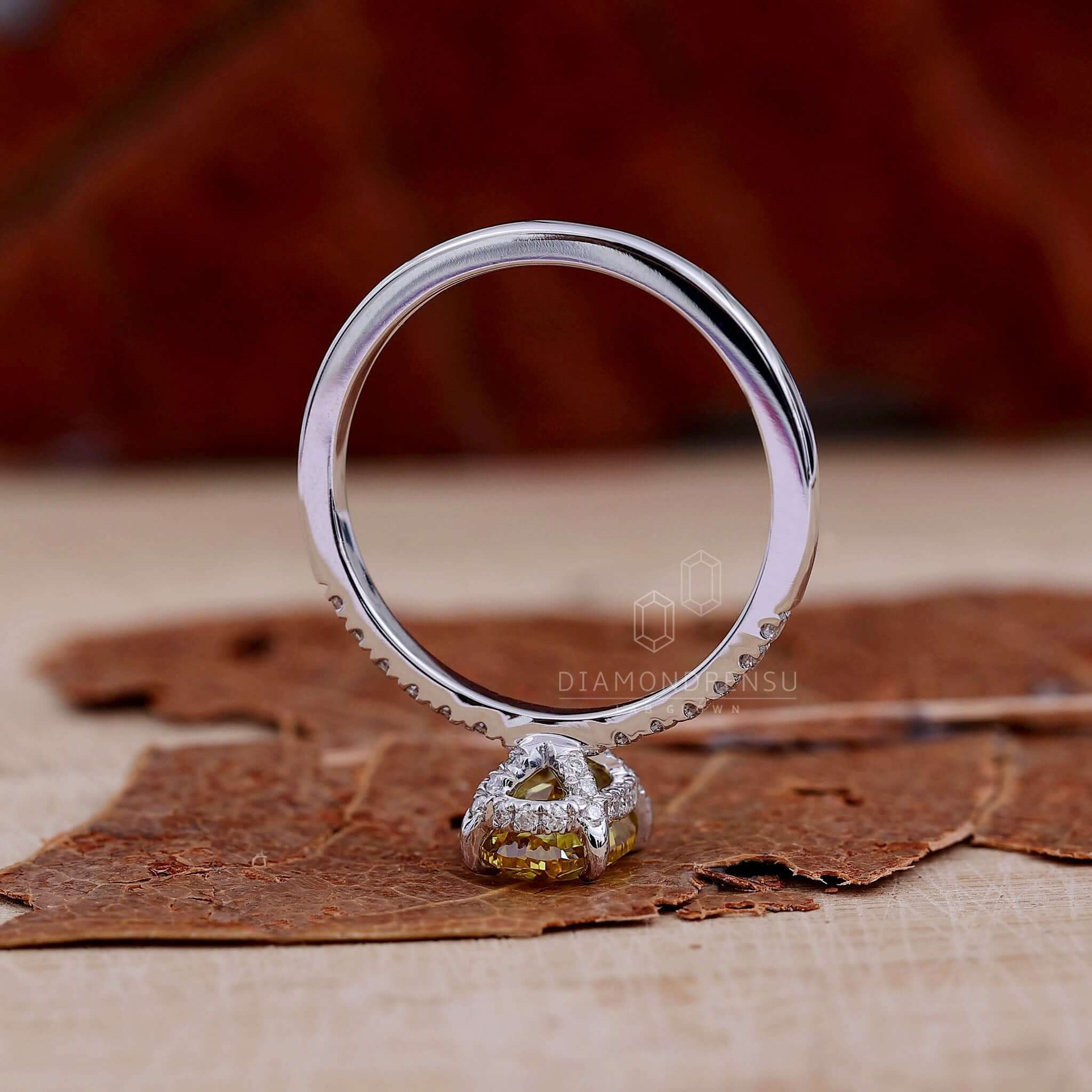 Oval diamond with hidden halo engagement ring designed for women seeking a unique and elegant piece.