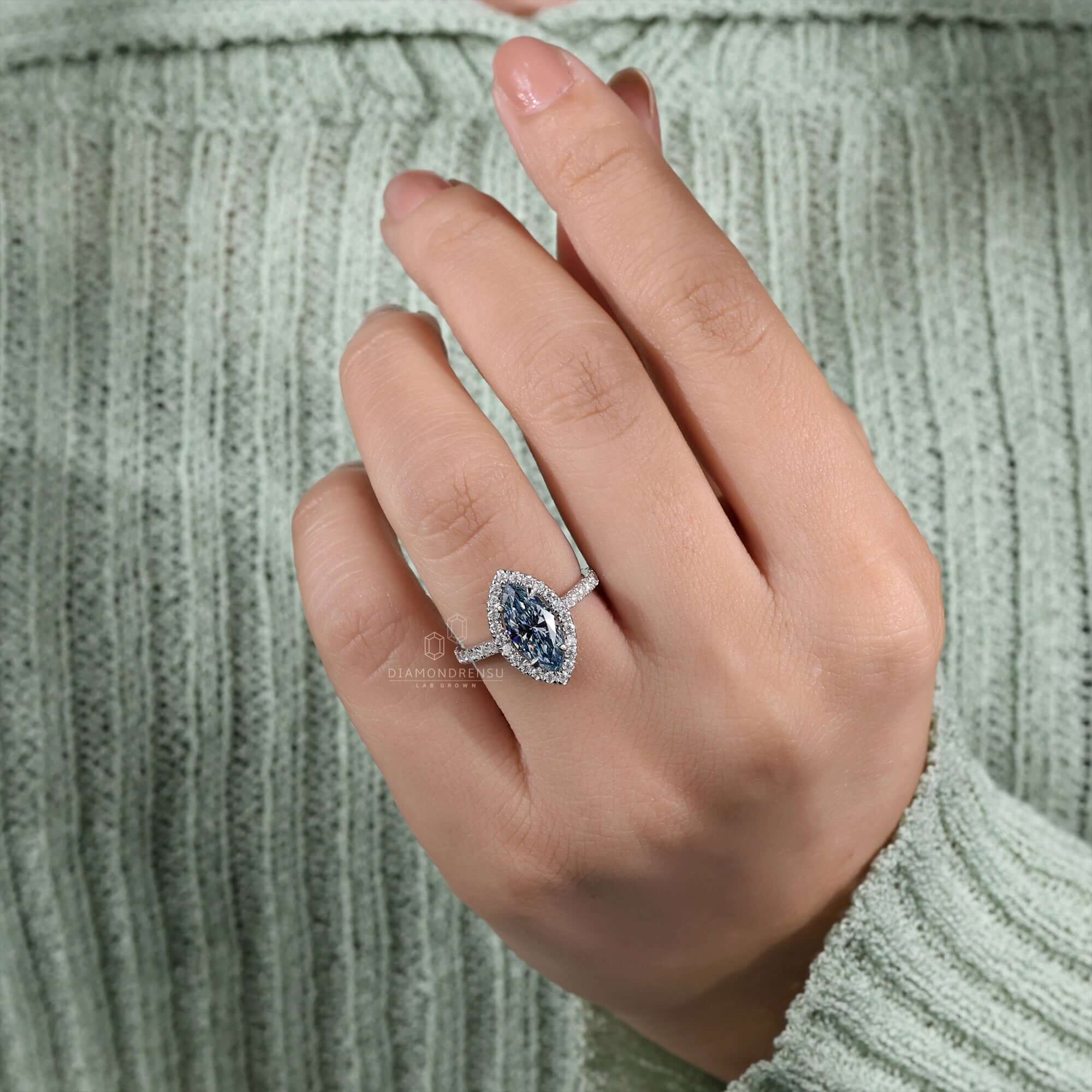 Marquise cut ring with a stunning halo ring ring design for modern brides.
