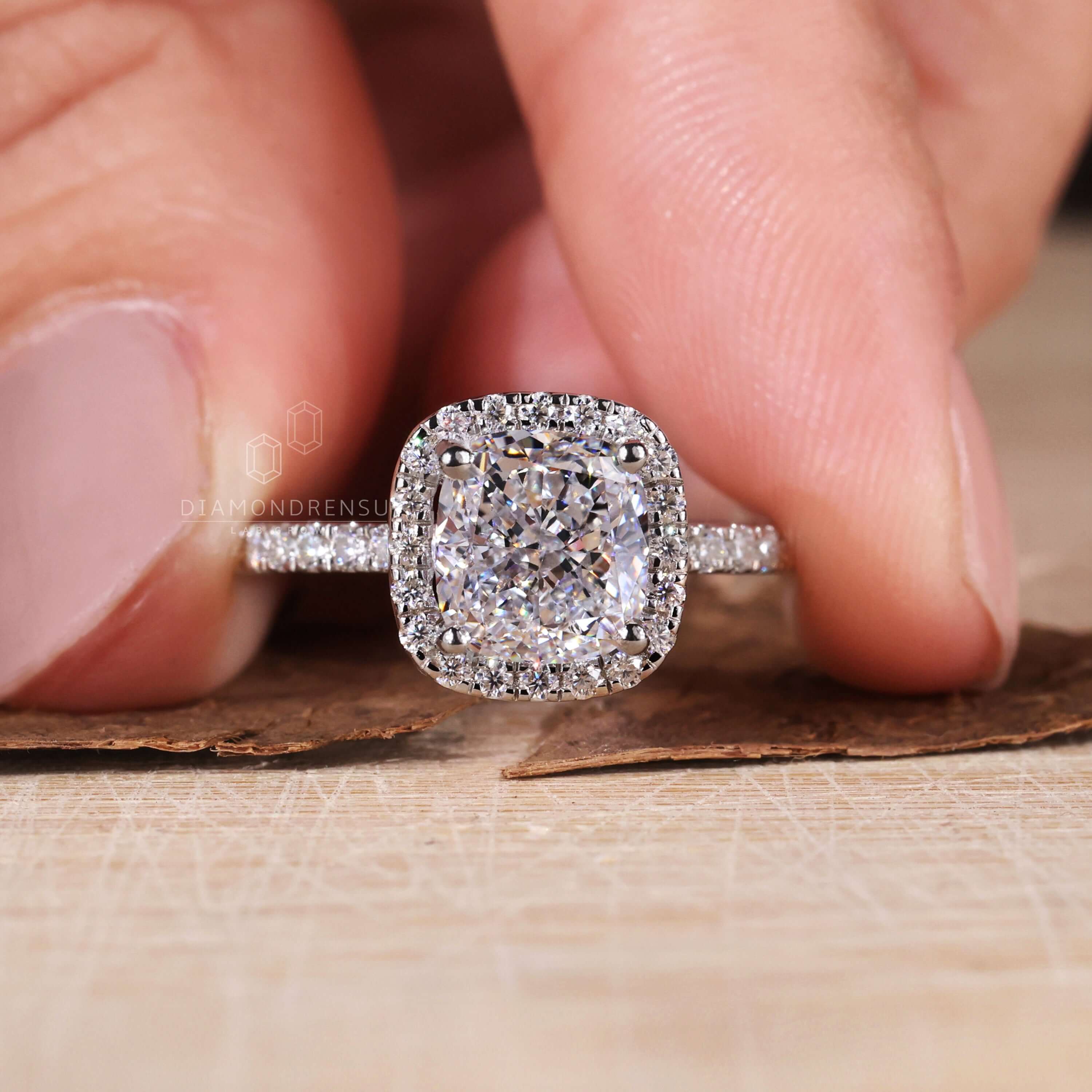 Cushion engagement ring with halo crafted from igi certified Lab Grown Diamonds for eco-conscious buyers.