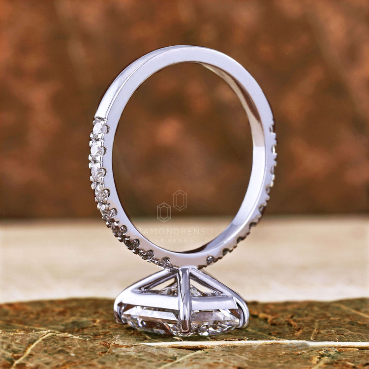 UK engagement ring with a radiant cut and pave setting for a luxurious finish.