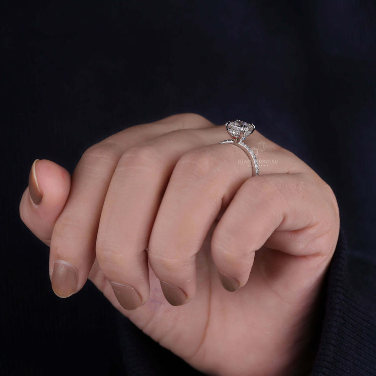 White gold engagement ring featuring a shared prong eternity band design