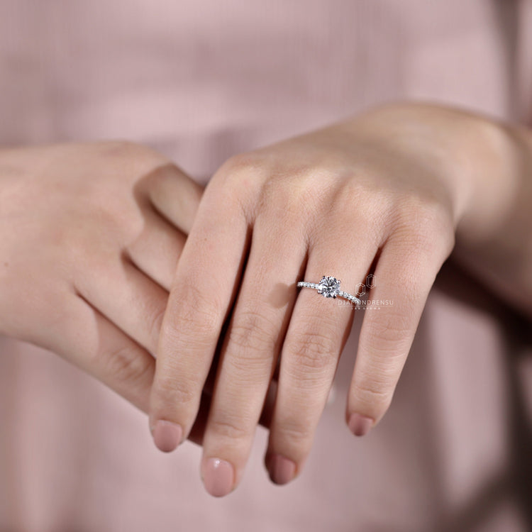 Diamondrensu UK engagement ring with a unique prong setting.