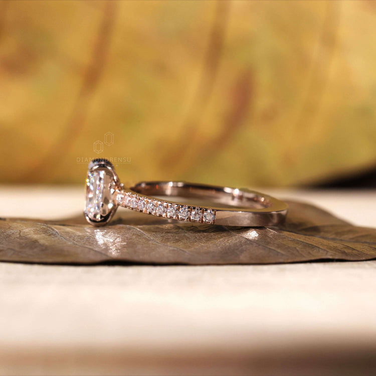 Engagement ring with pave band and a radiant cut diamond