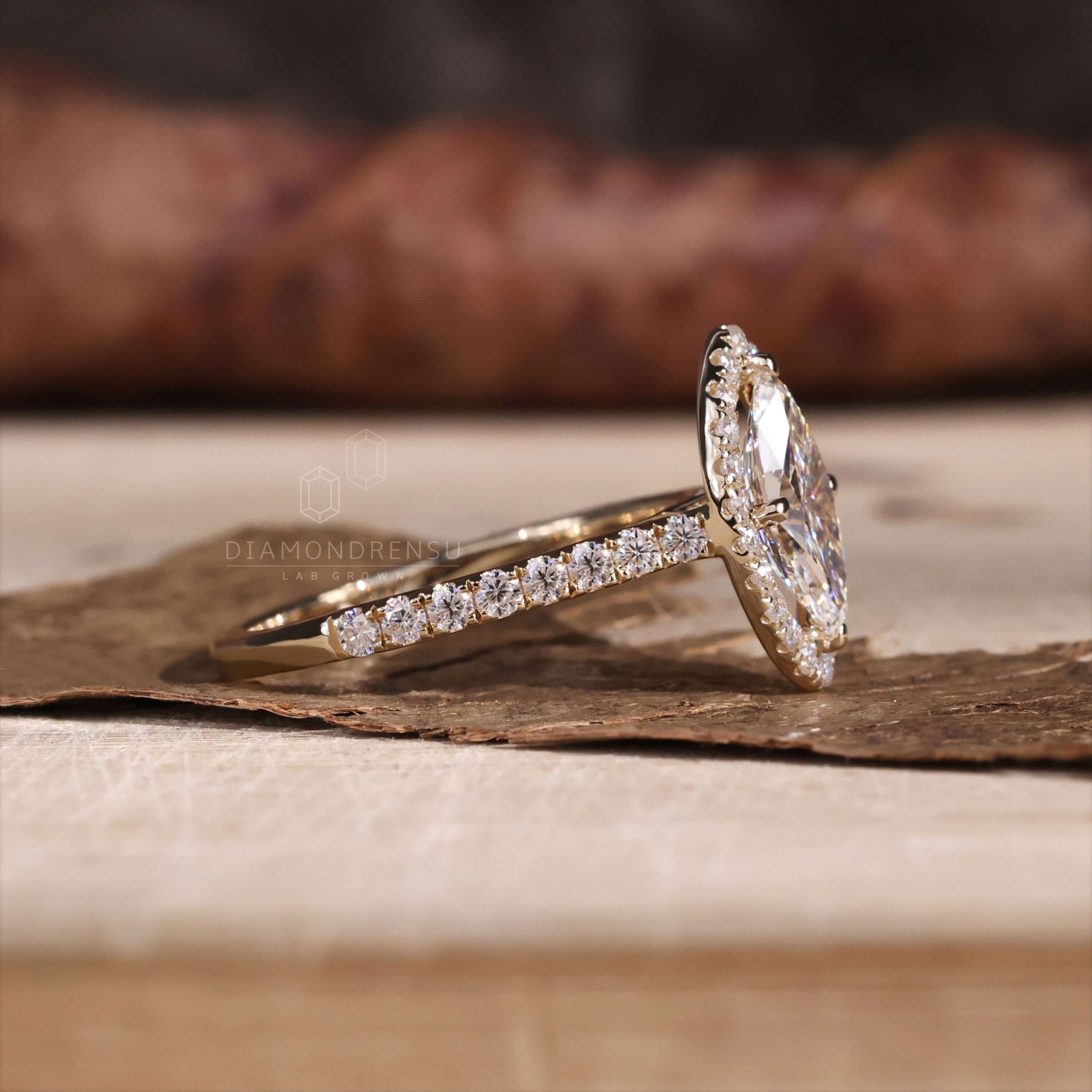 Marquise cut engagement ring crafted with yellow gold elegance