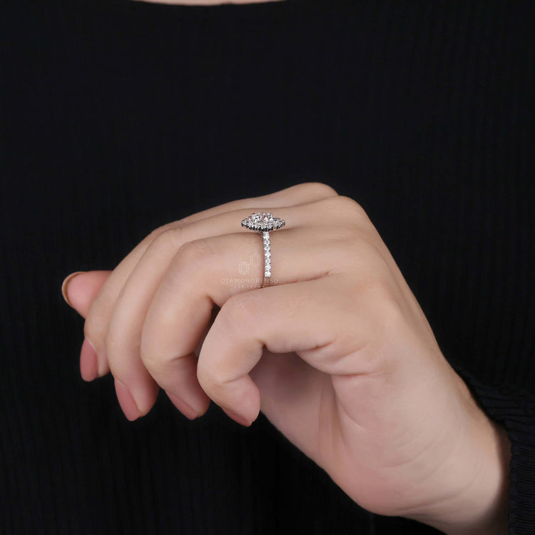 Round brilliant cut diamond ring with halo engagement ring setting for added brilliance and charm.