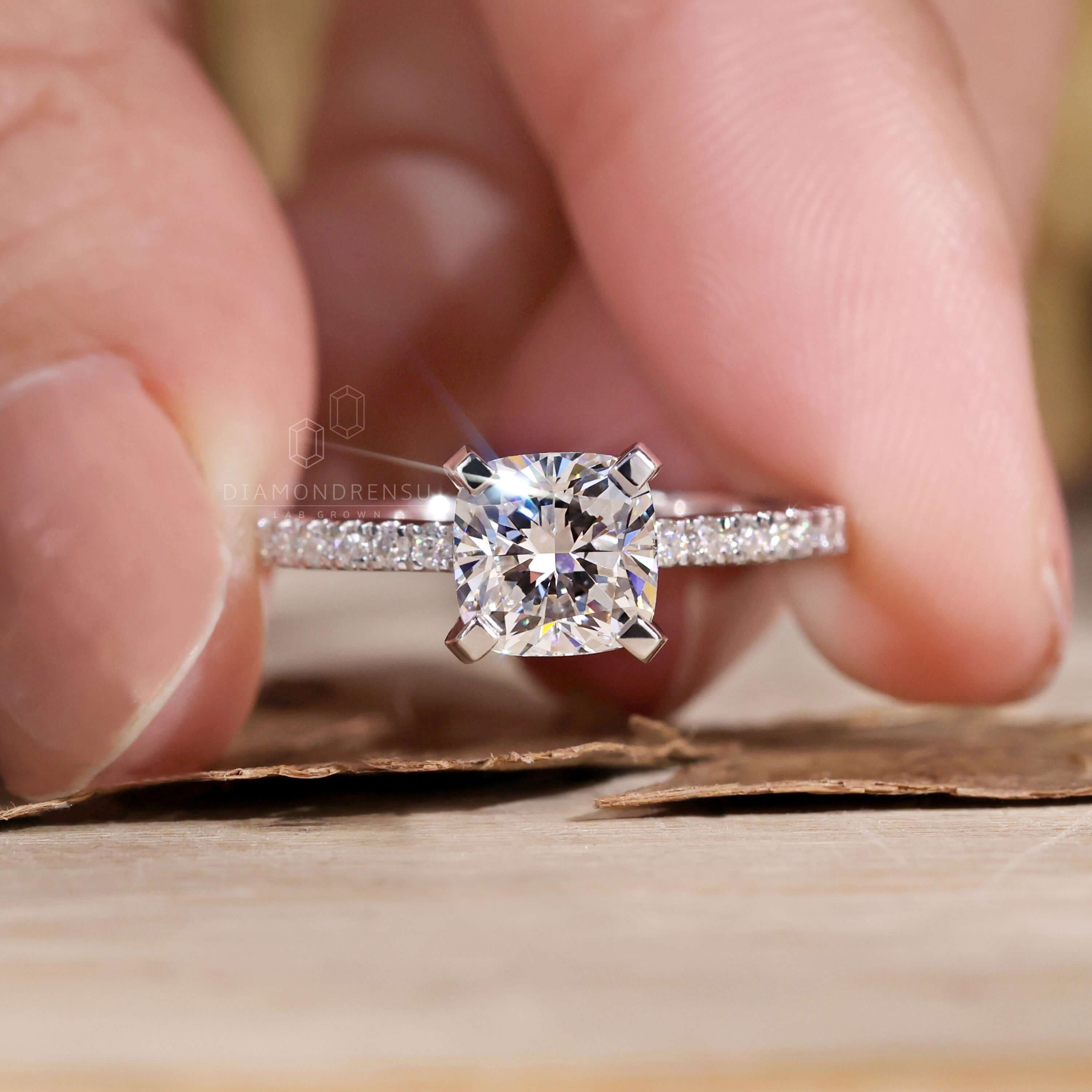 Cushion ring cut paired with pave detailing for a timeless engagement piece.