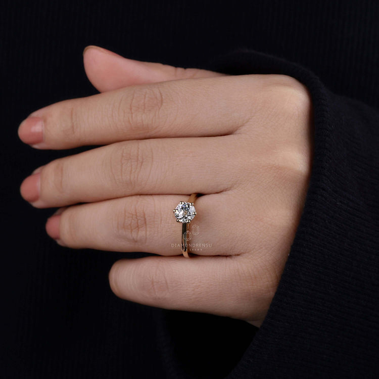 Unique engagement ring in a round cut diamond style with a cathedral ring setting