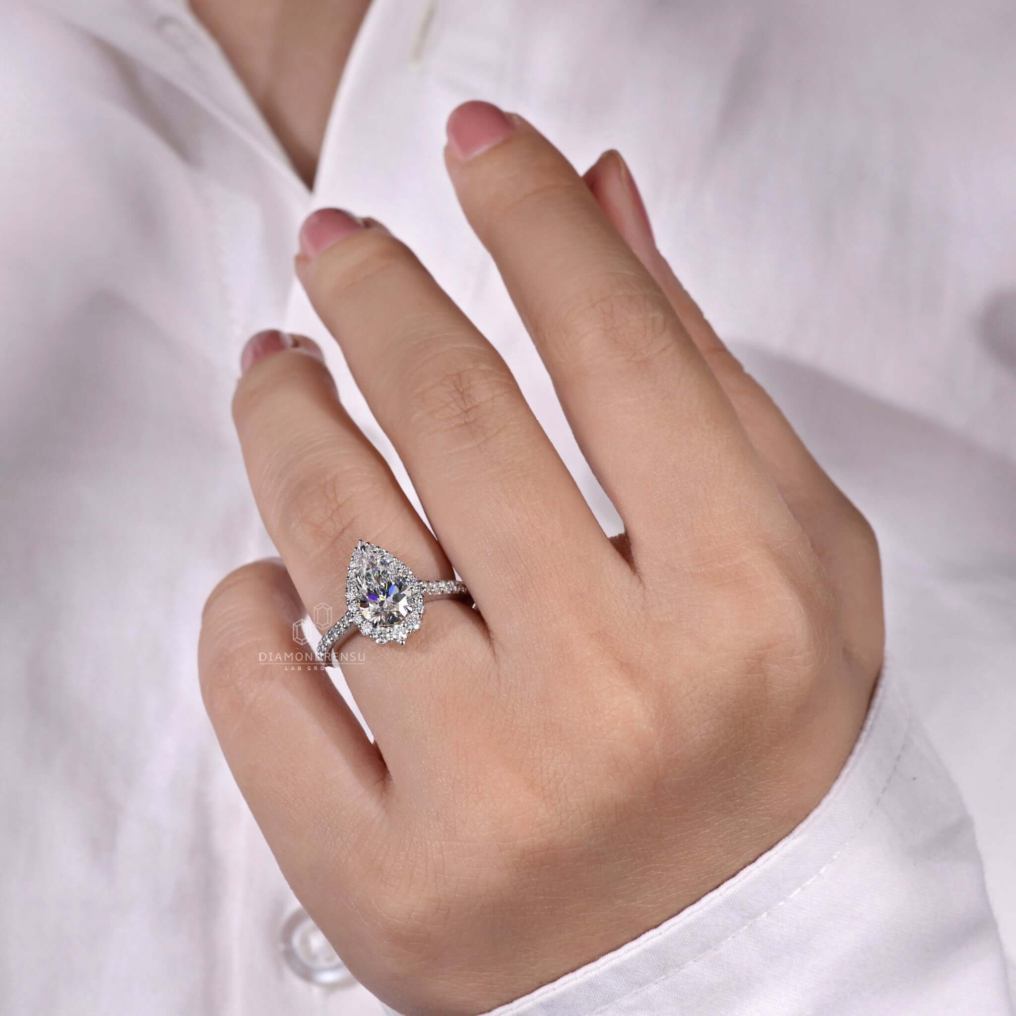 Custom halo pear shaped ring crafted by Diamondrensu UK.