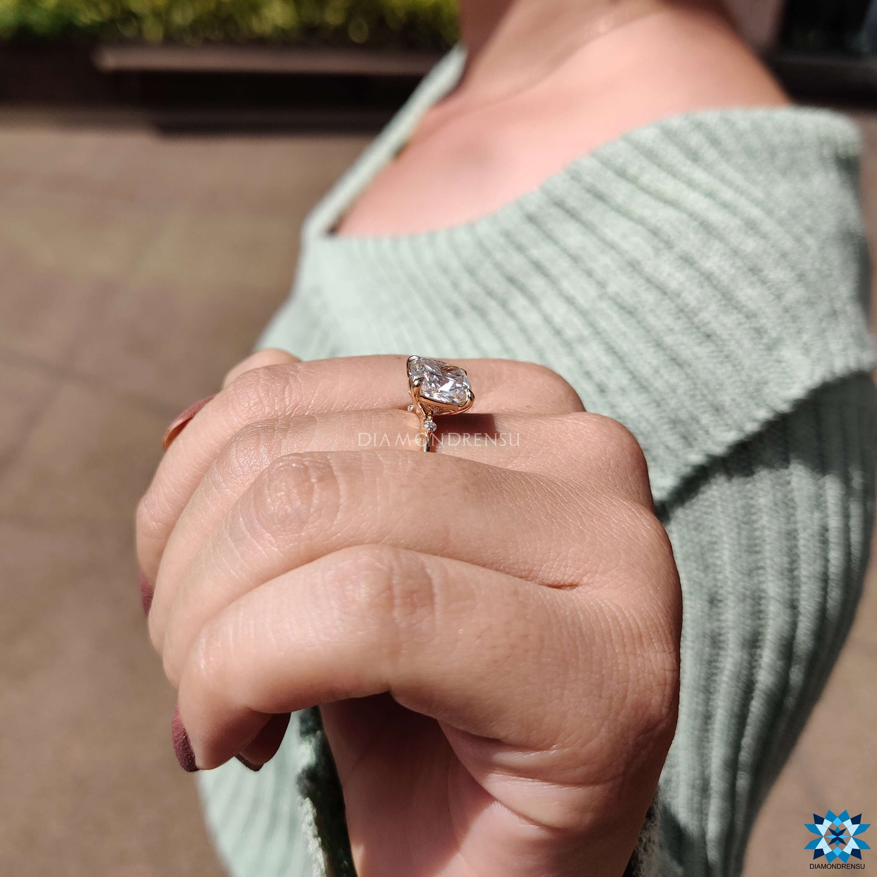 Handmade moissanite ring with detailed pave accents.
