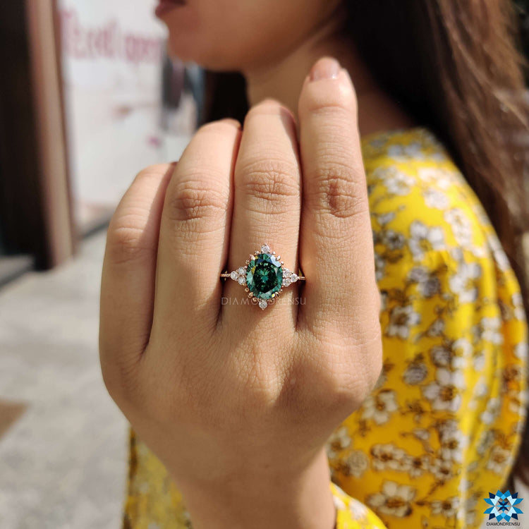 Custom engagement ring with green oval moissanite.