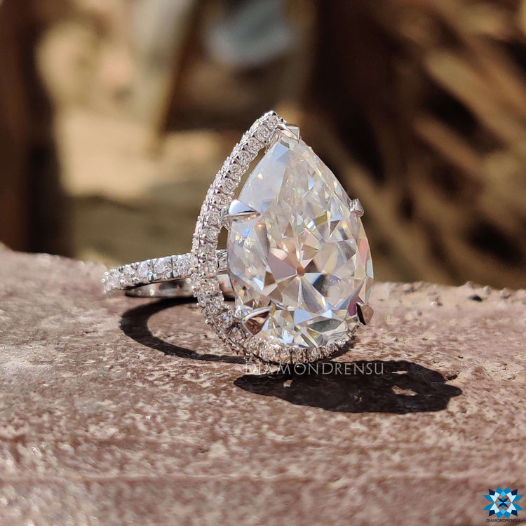 Handmade engagement ring with pear old European cut and prong mount.