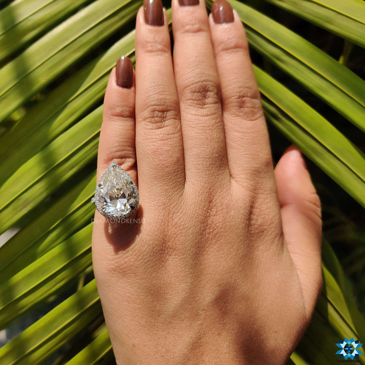 White gold engagement ring featuring pear shape and old European cut moissanite.