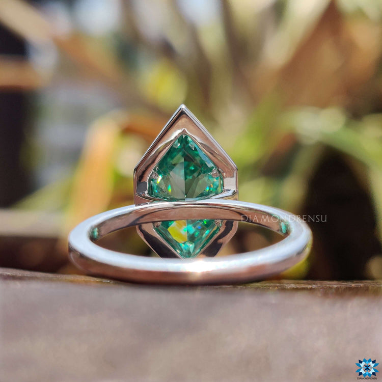 White gold moissanite halo ring.