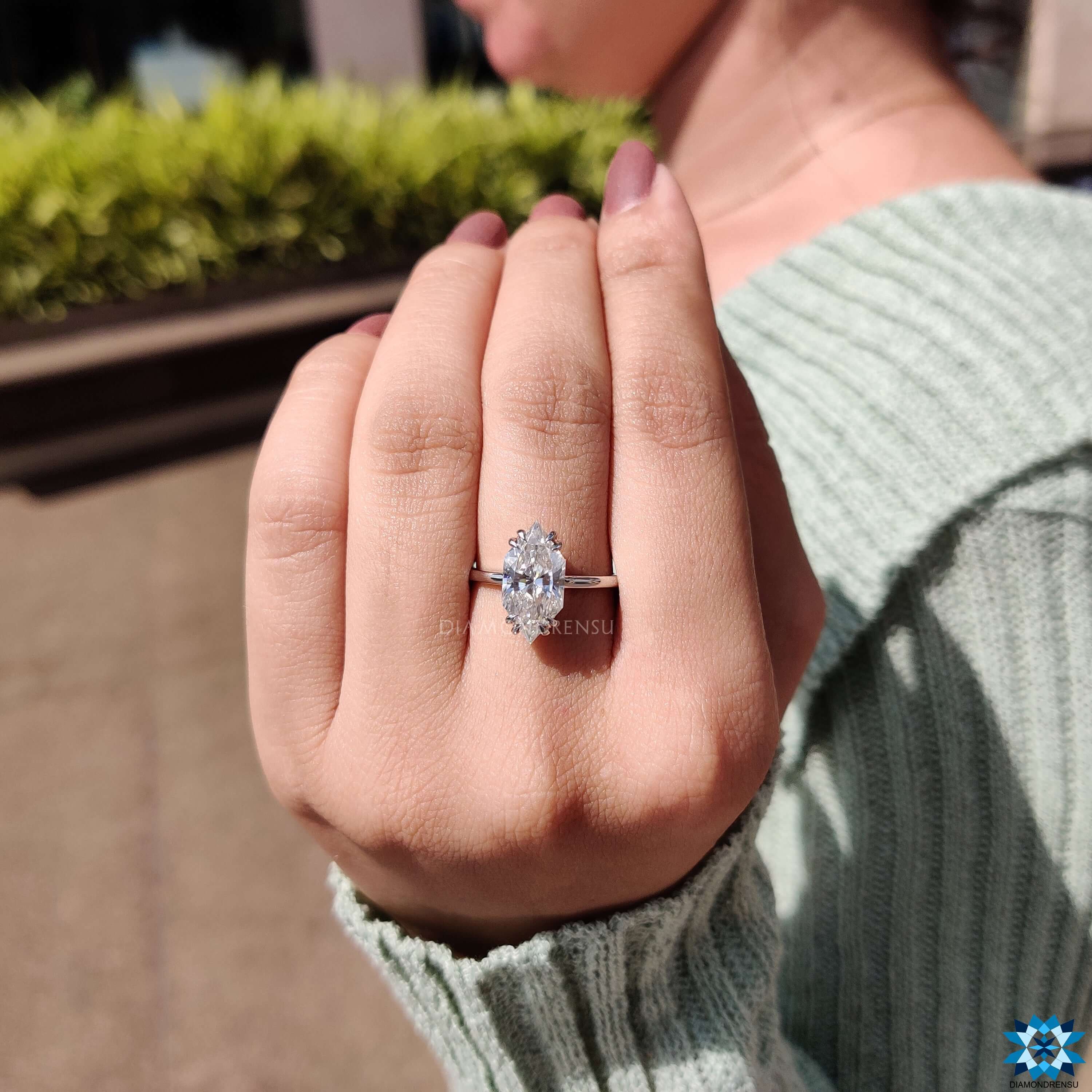 Hidden halo moissanite ring with round cut accent.