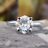 Octagon cut moissanite solitaire ring in white gold.