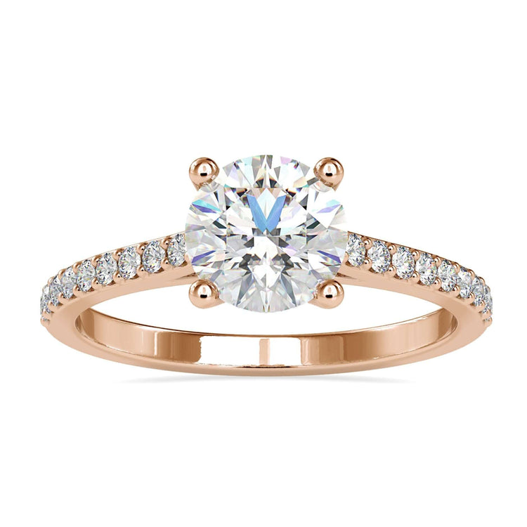 Pave band engagement ring with round cut diamond in rose gold.