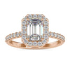 Emerald halo engagement ring with pave round cut band.