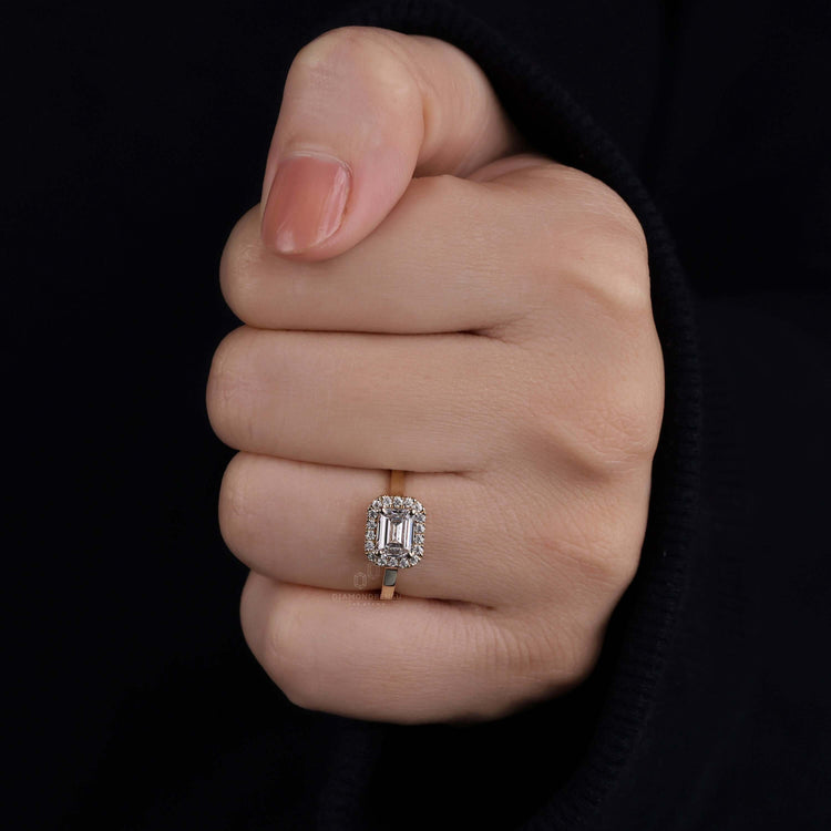 Emerald halo ring with intricate craftsmanship, perfect for engagements.