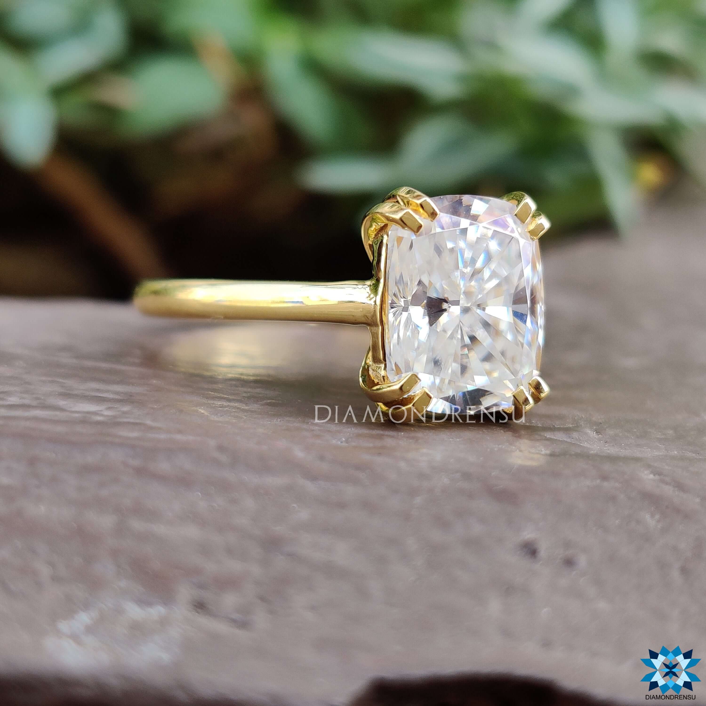 Handmade elongated cushion cut ring.