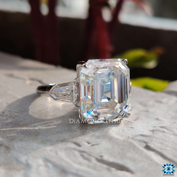 Custom three stone ring with bullet cut and claw prong setting.