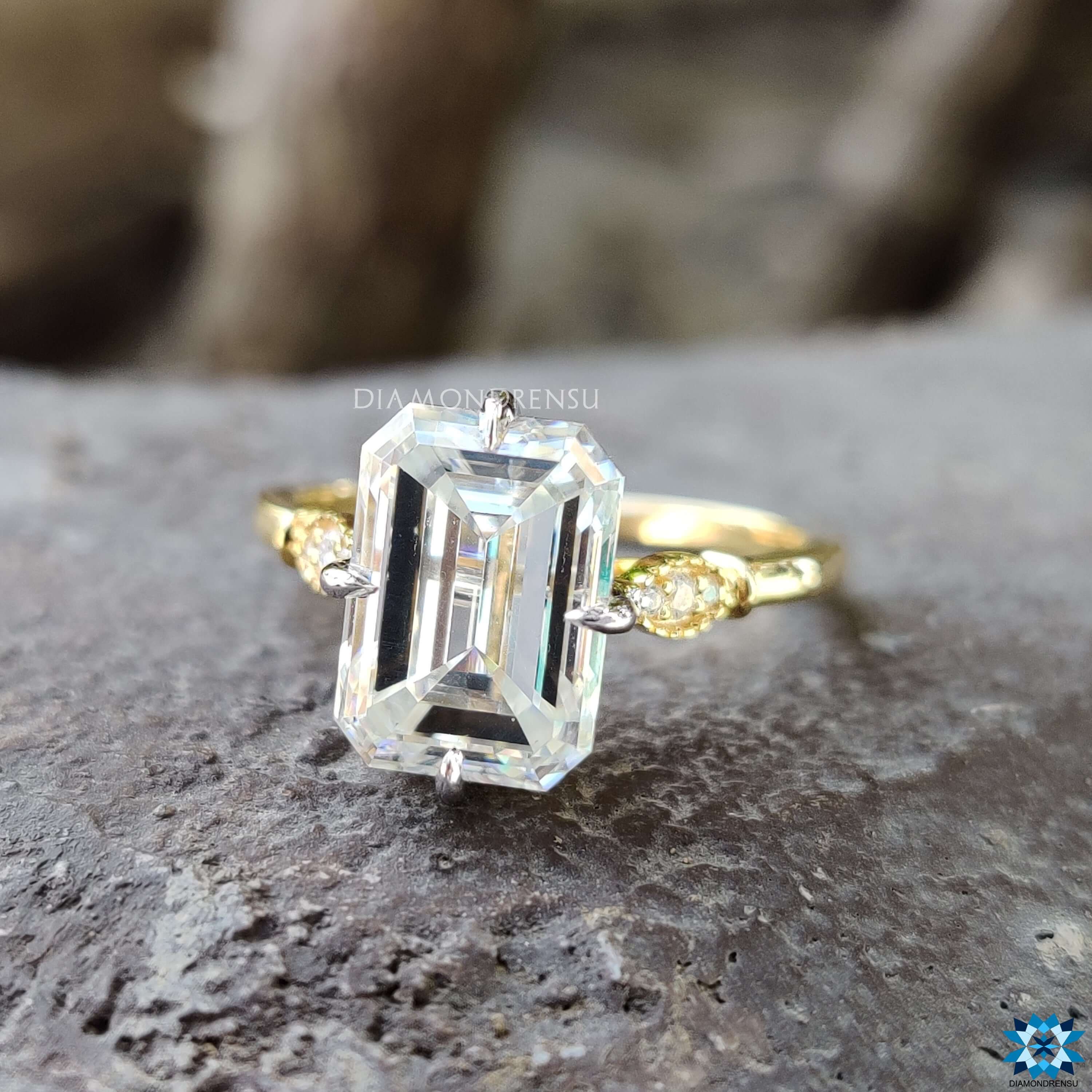 Vintage style emerald cut moissanite ring in yellow gold.