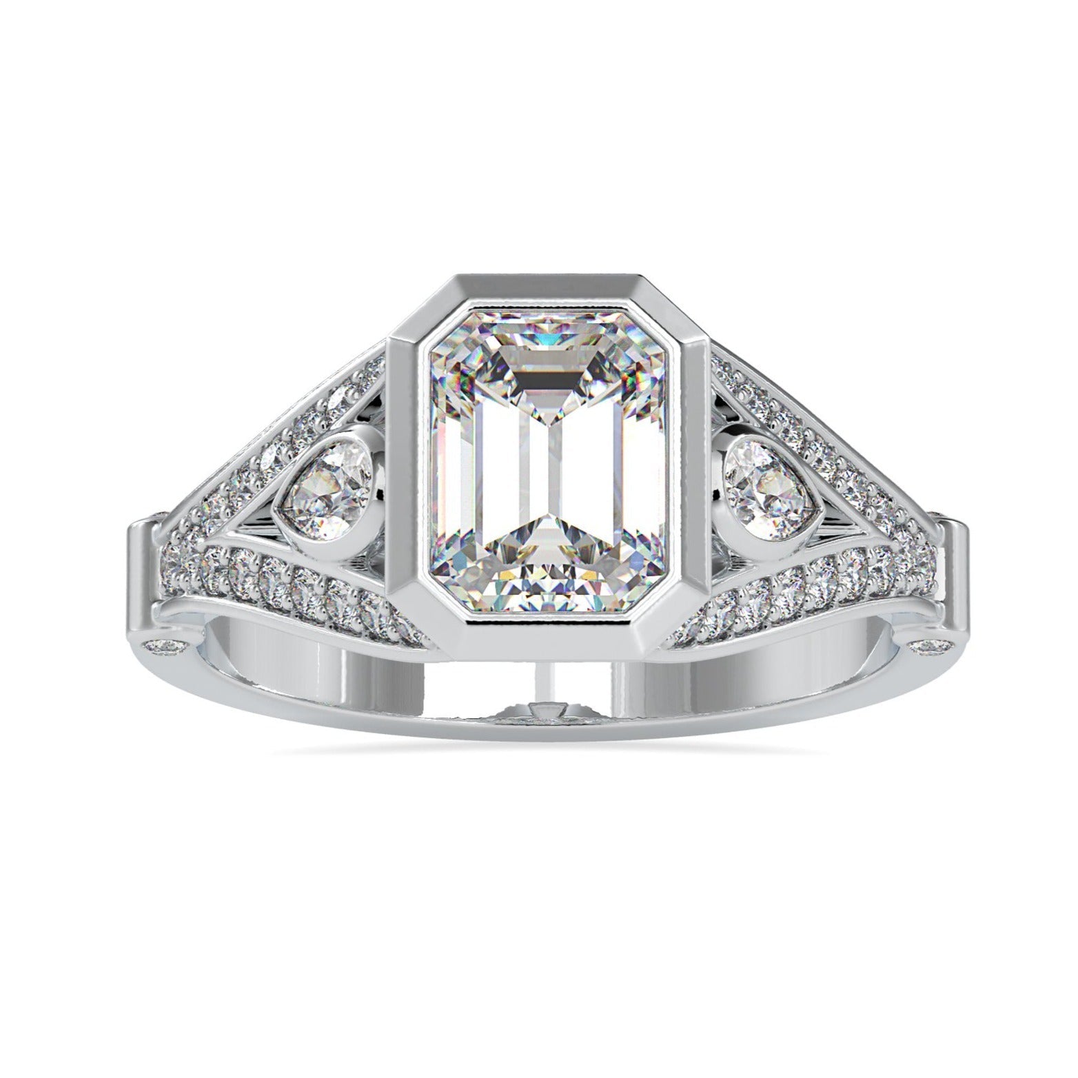 Three stone diamond ring with emerald centre and pear side stones.