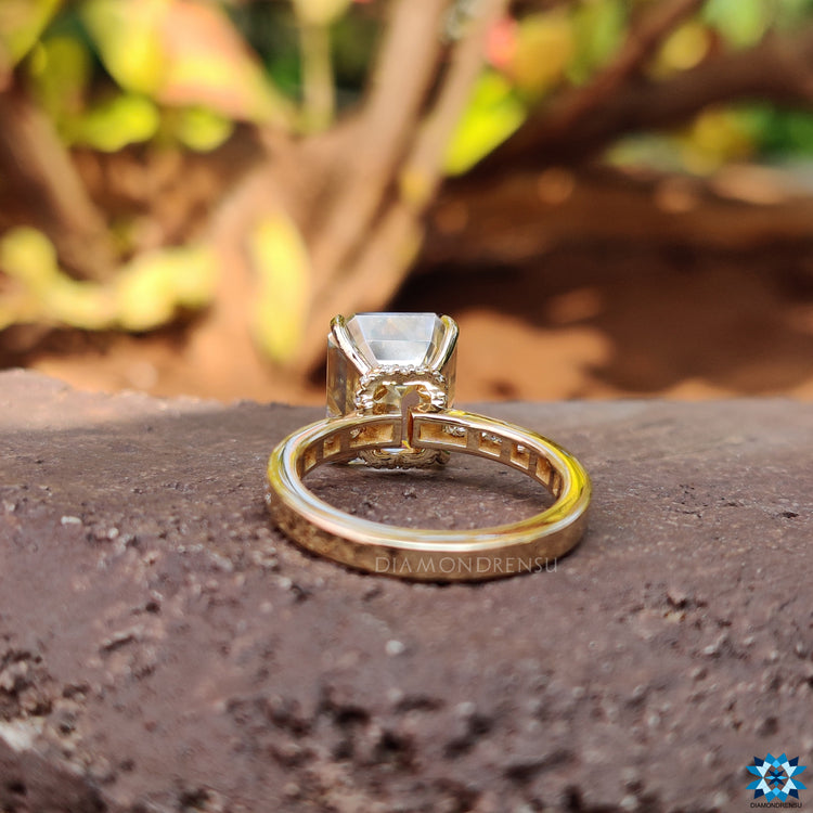 Light yellow moissanite ring with pave setting and hidden halo detail.