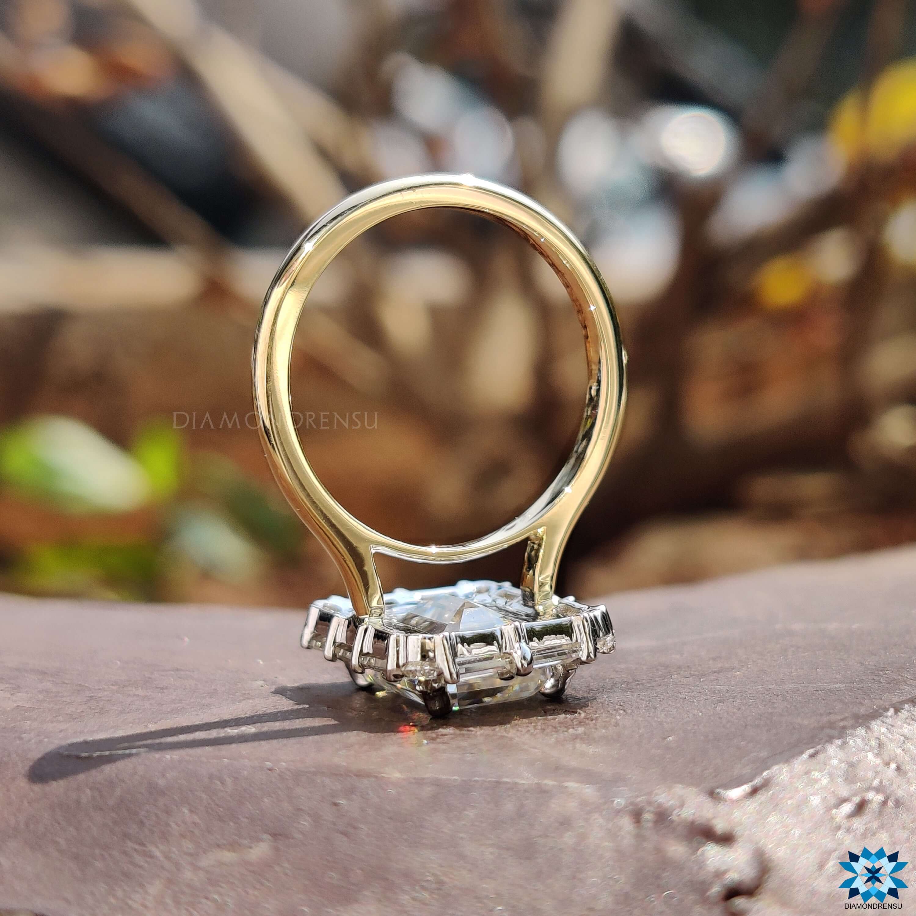 Custom engagement ring with halo and baguette details.