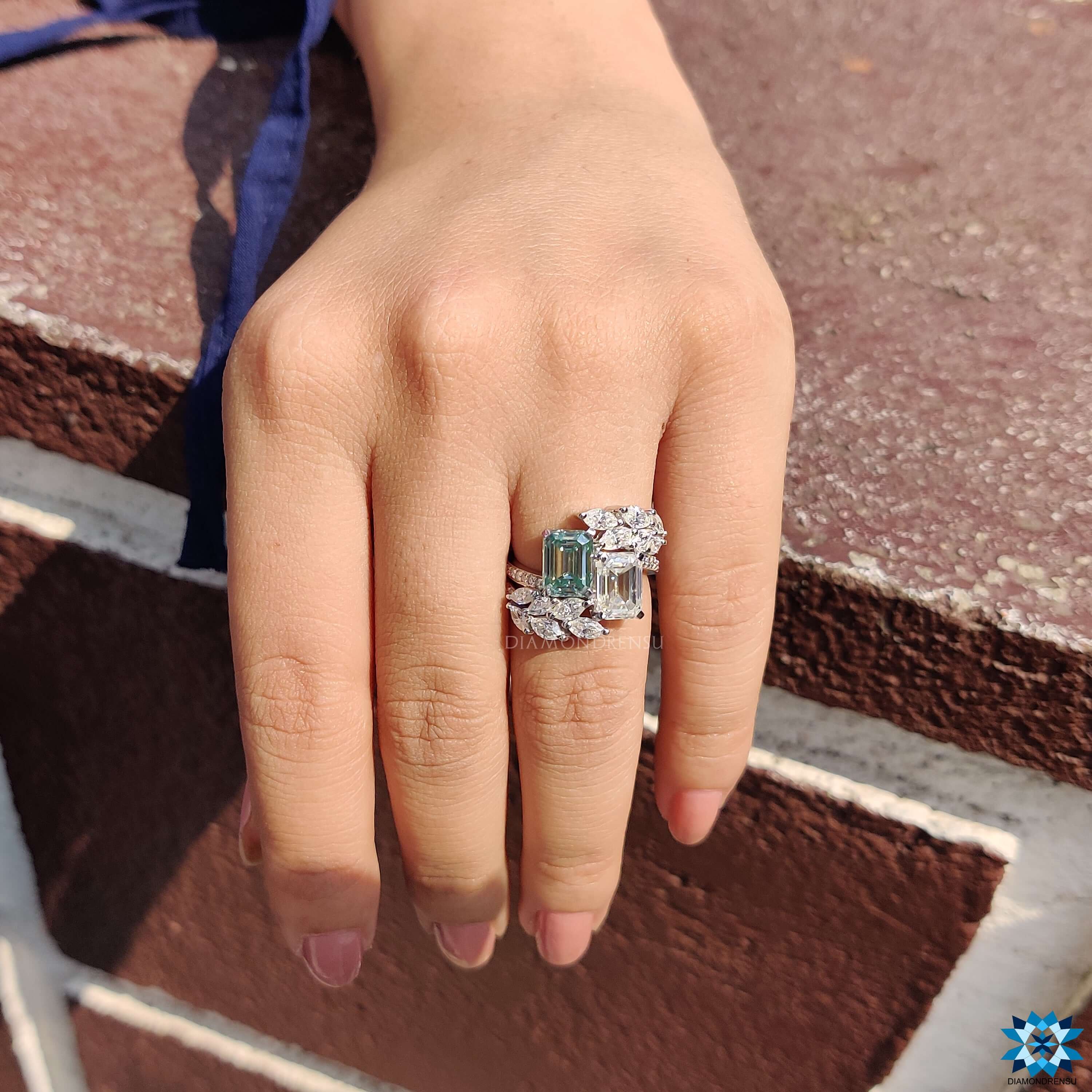 Handmade emerald cut ring with marquise and round accents.