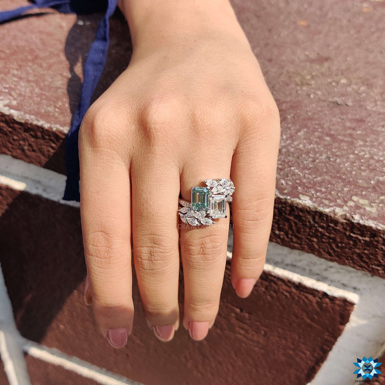 Handmade emerald cut ring with marquise and round accents.