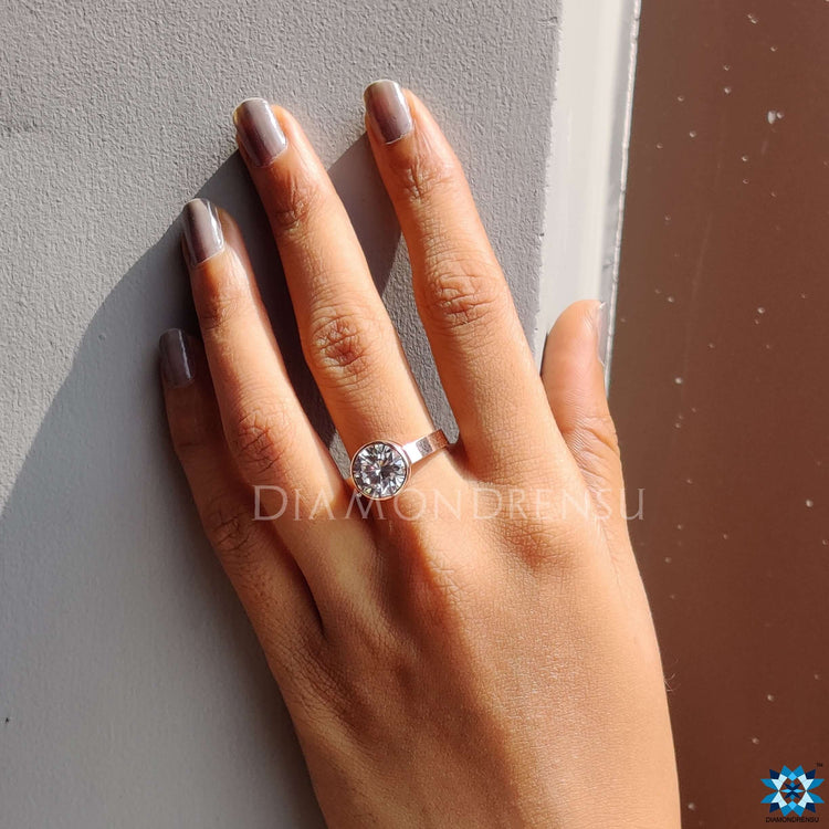 Rose gold engagement ring with bezel design