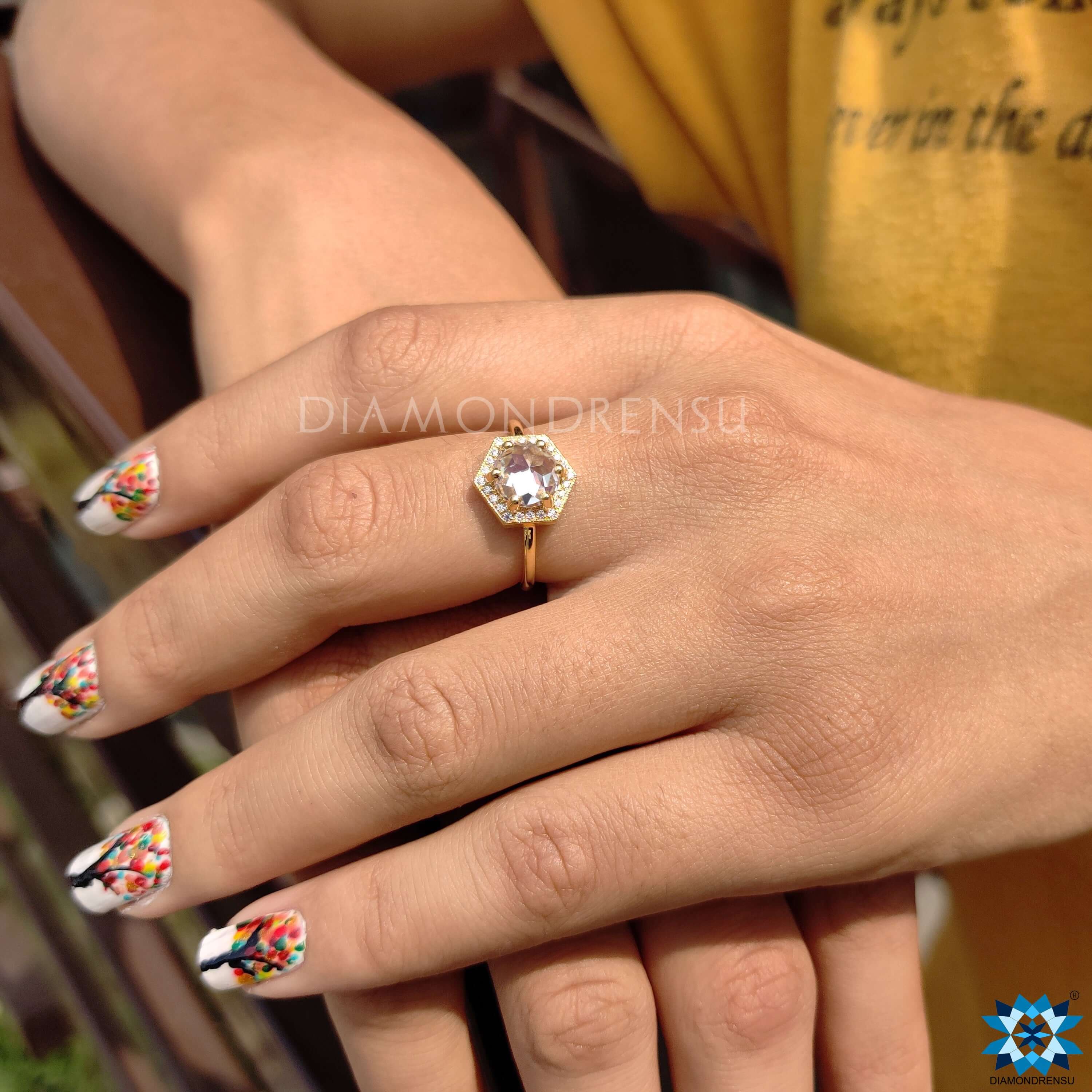 Yellow gold halo ring with vintage style milgrain.