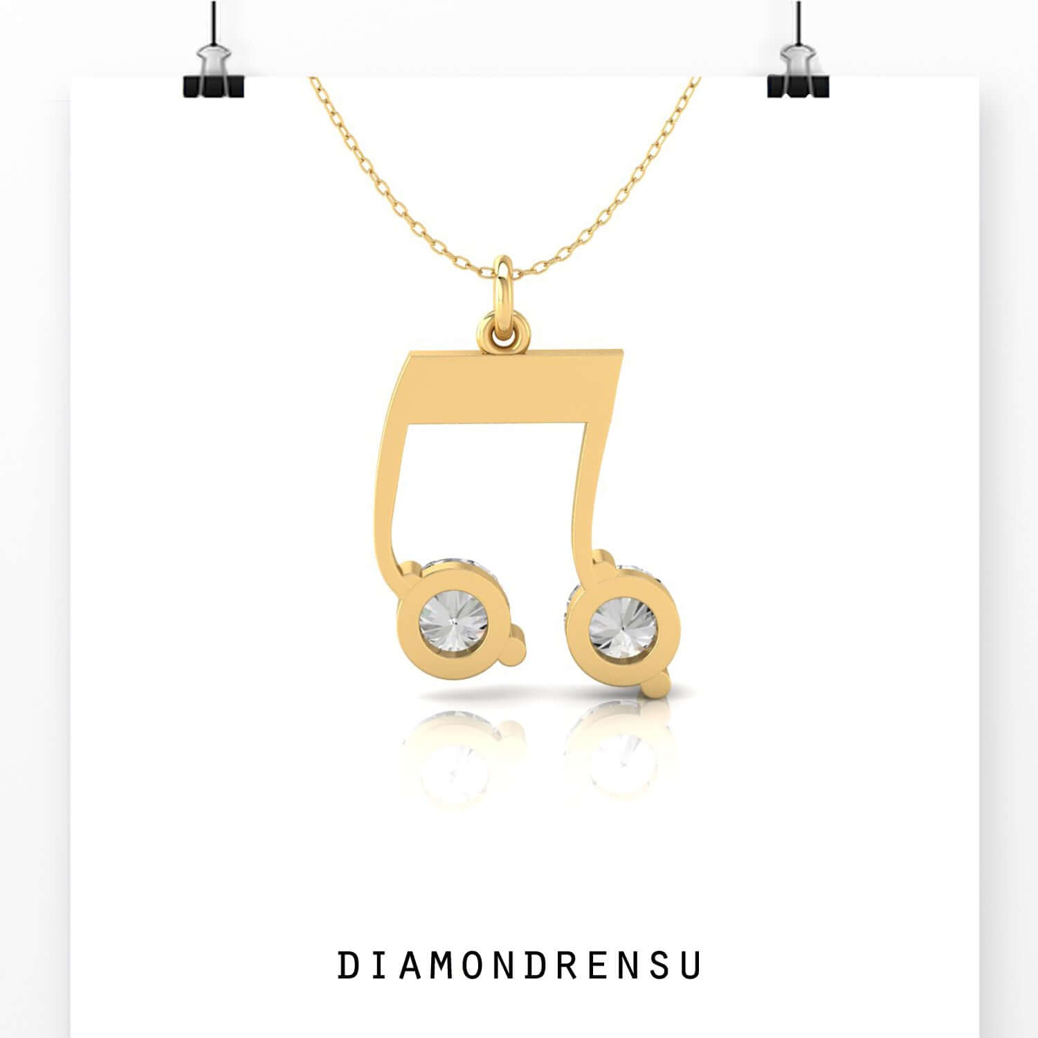 Music note pendant in gold with handcrafted prong setting.