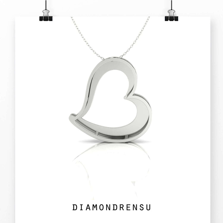 Handmade heart pendant in rose gold with diamond touch.