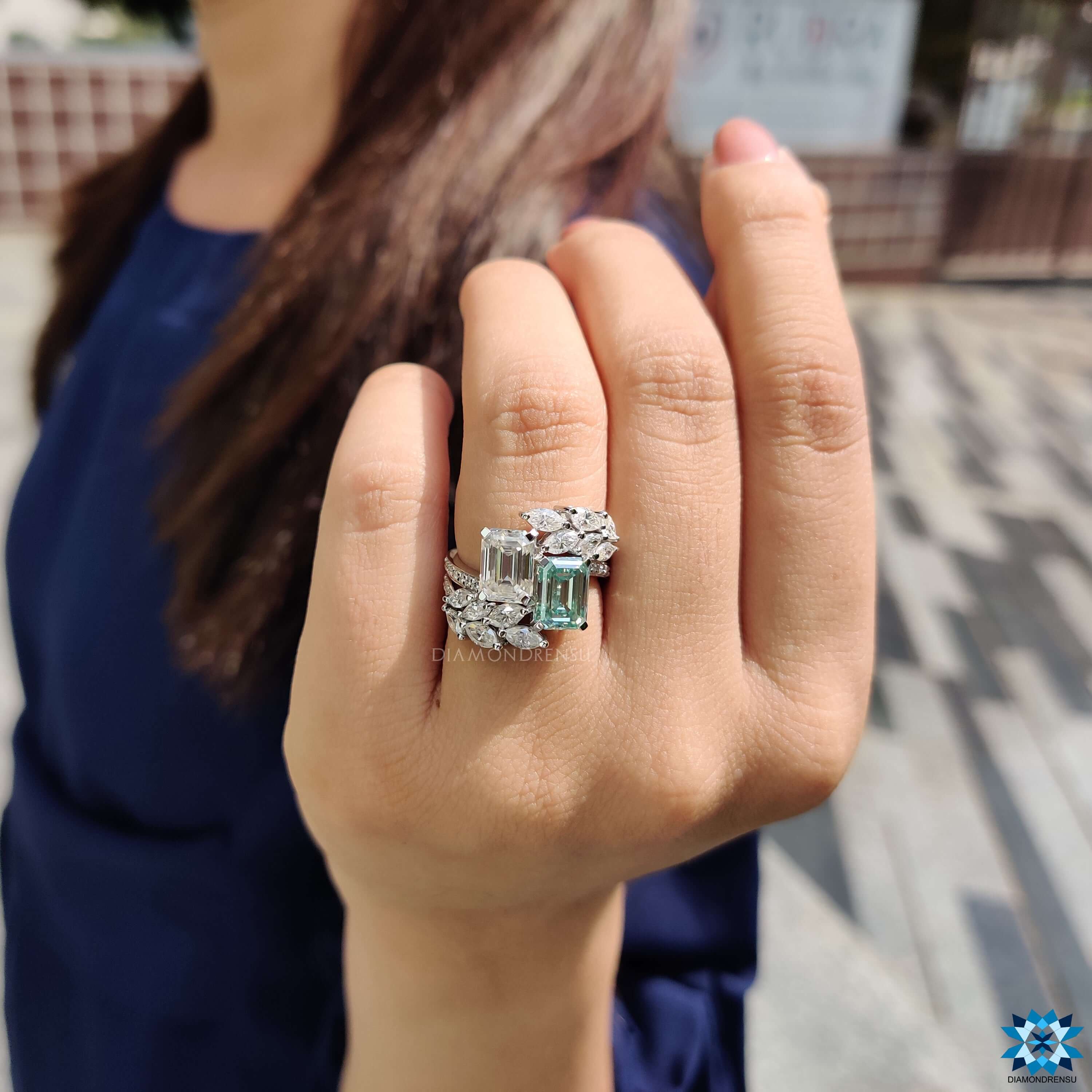 Unique design engagement ring with mixed side stones.