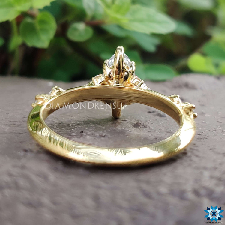 Handmade marquise cut moissanite ring with claw prong setting.