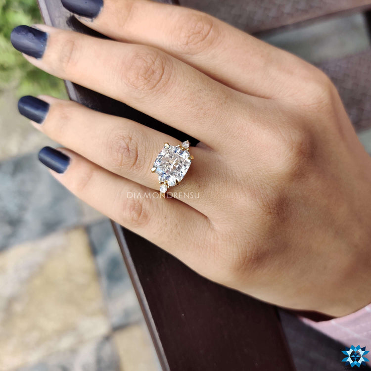 Diamondrensu UK ring crafted with a cushion moissanite and 4 claw prong setting.