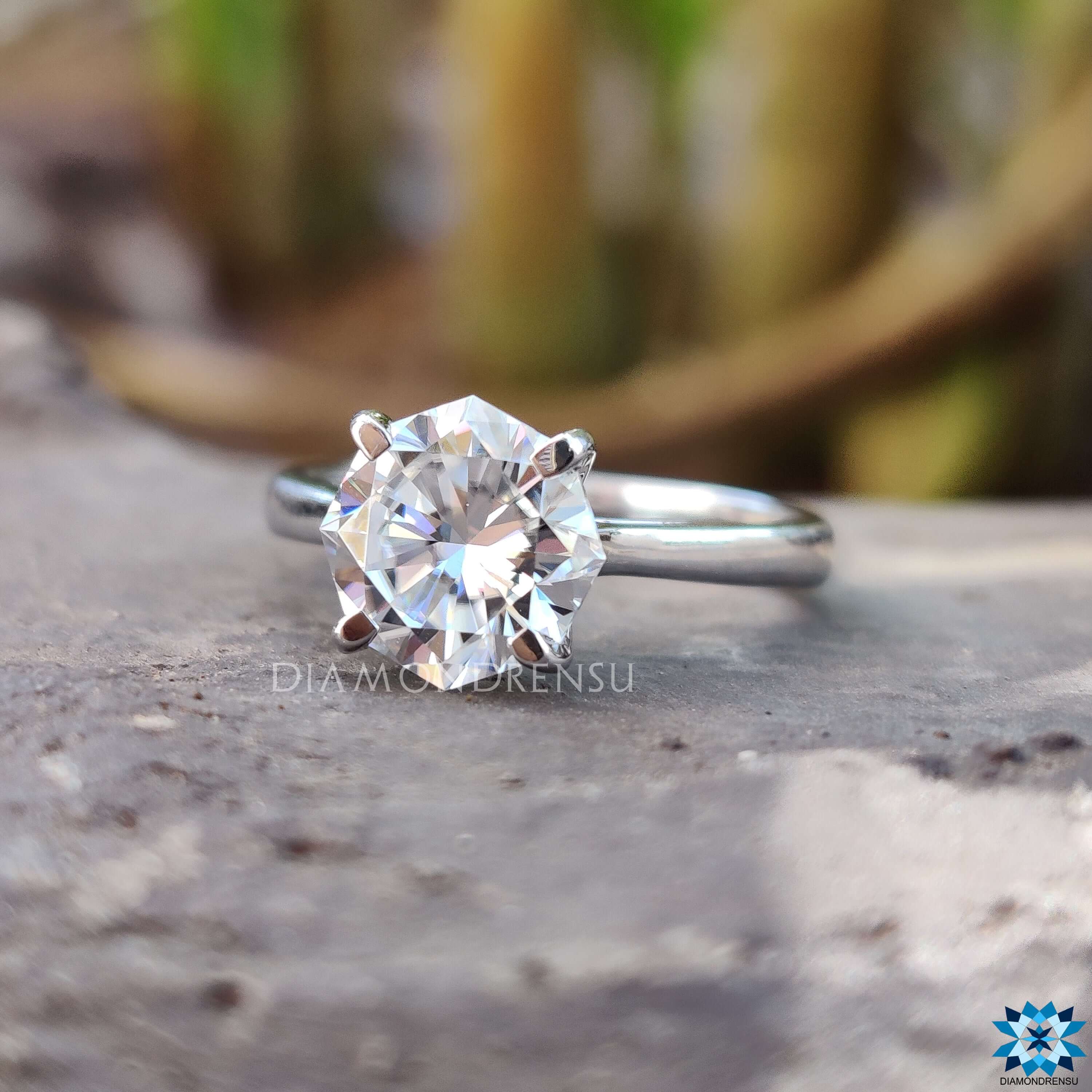 Handmade solitaire ring with octagon moissanite in prong setting.
