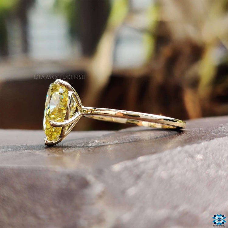 Pear cut moissanite ring with solitaire setting.