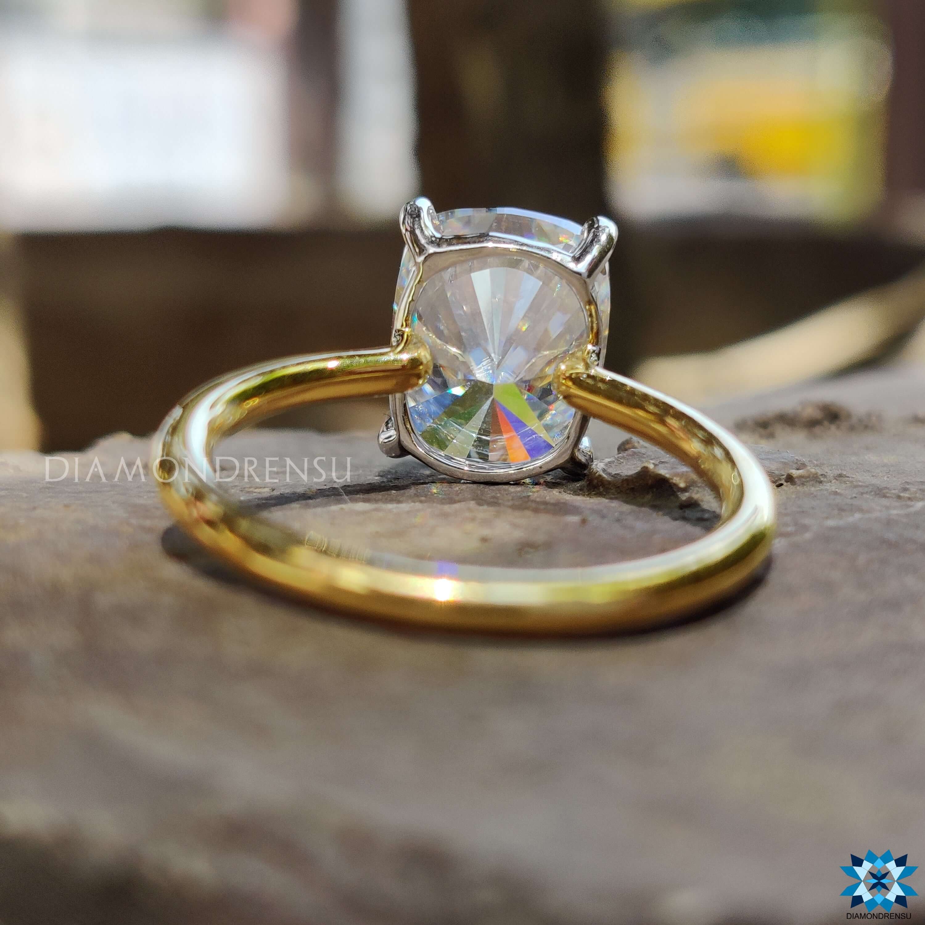 Custom engagement ring with elongated cushion cut stone.