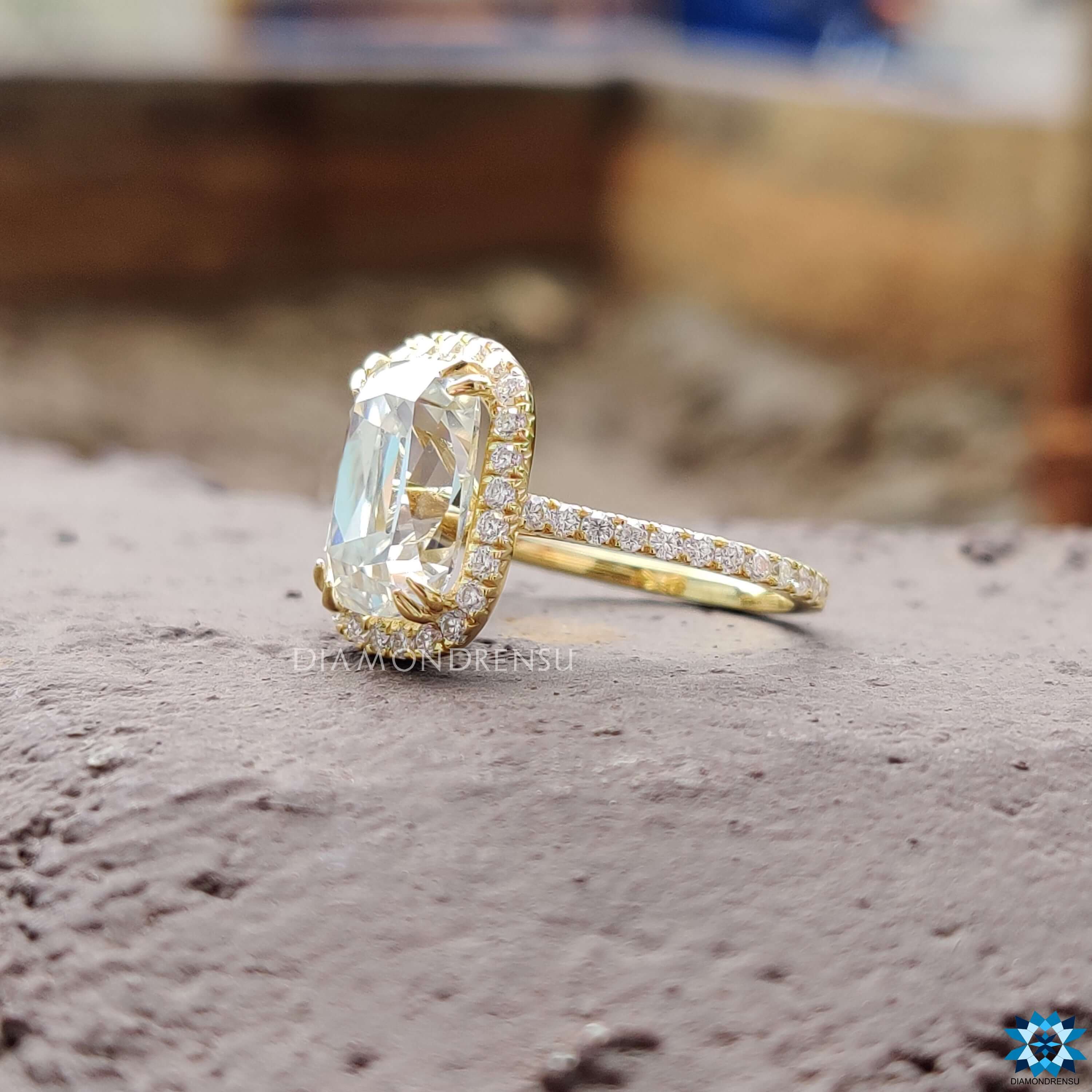 Handmade moissanite ring with double claw prongs.