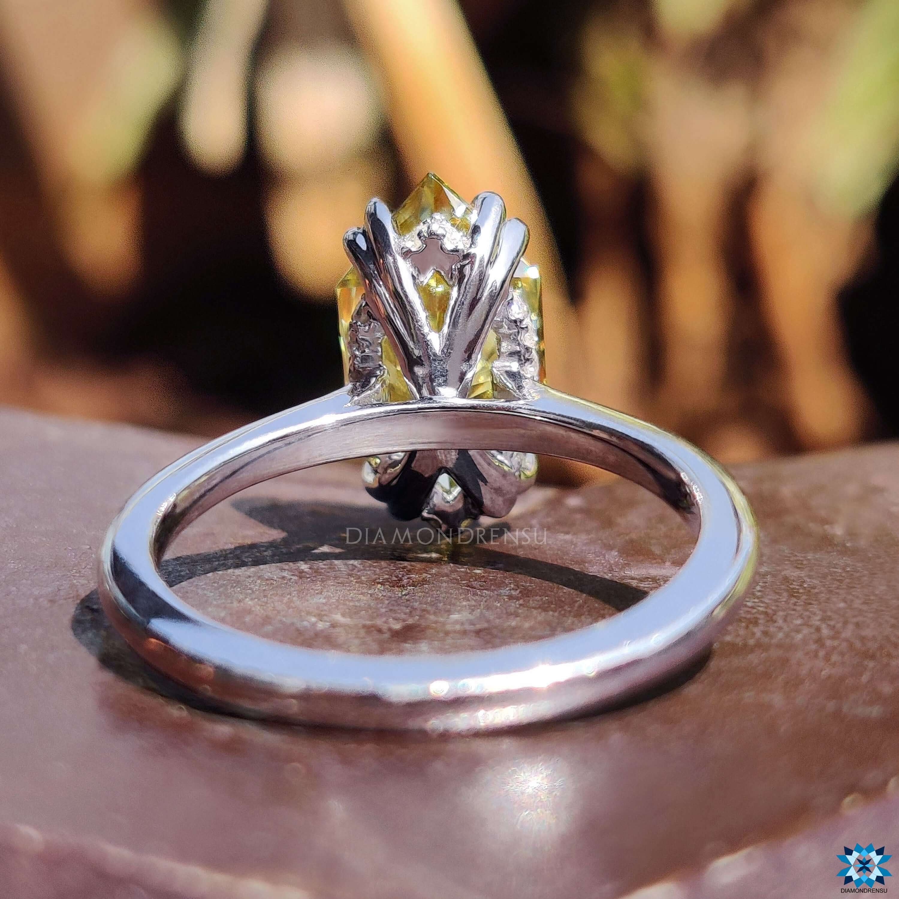 White gold ring featuring Dutch marquise moissanite.