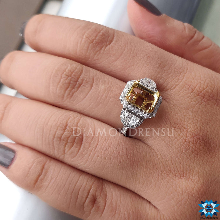 Three stone moissanite ring featuring half moon side stones.