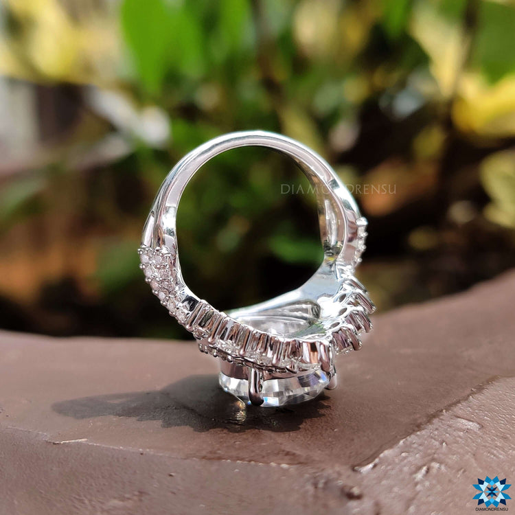 Crossover pave ring with round cut moissanite accents.