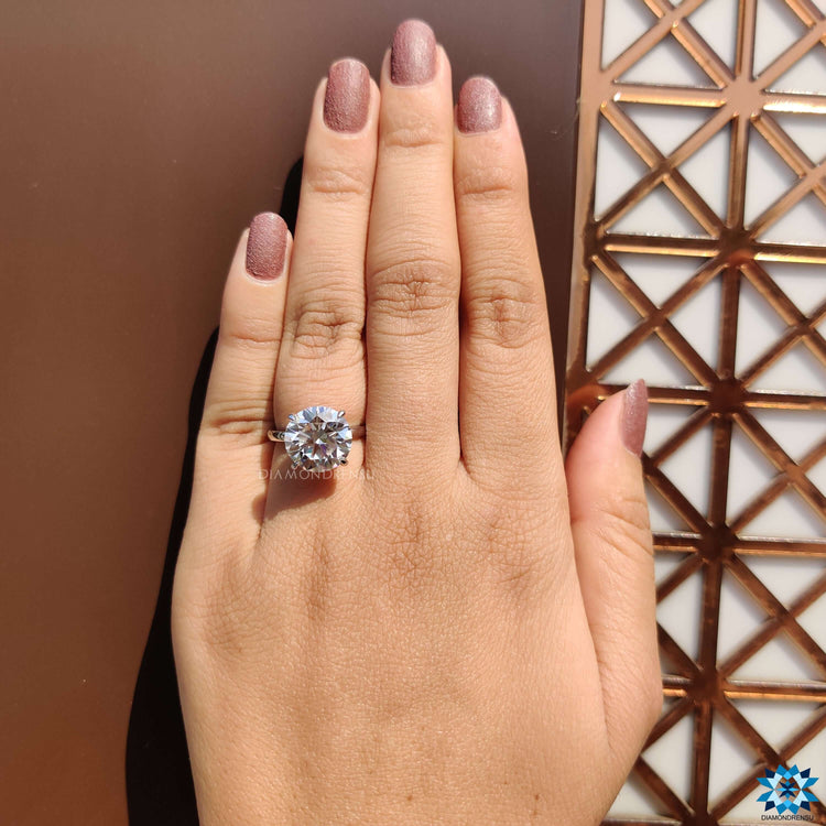 Custom engagement ring with round cut moissanite and hidden halo.